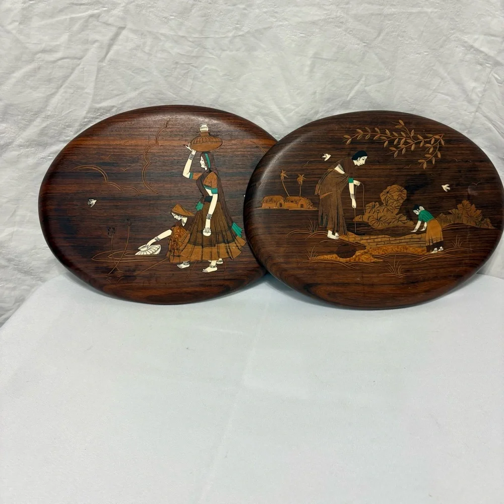 Vintage Indian rosewood wall art plaques with intricate bone inlay designs.